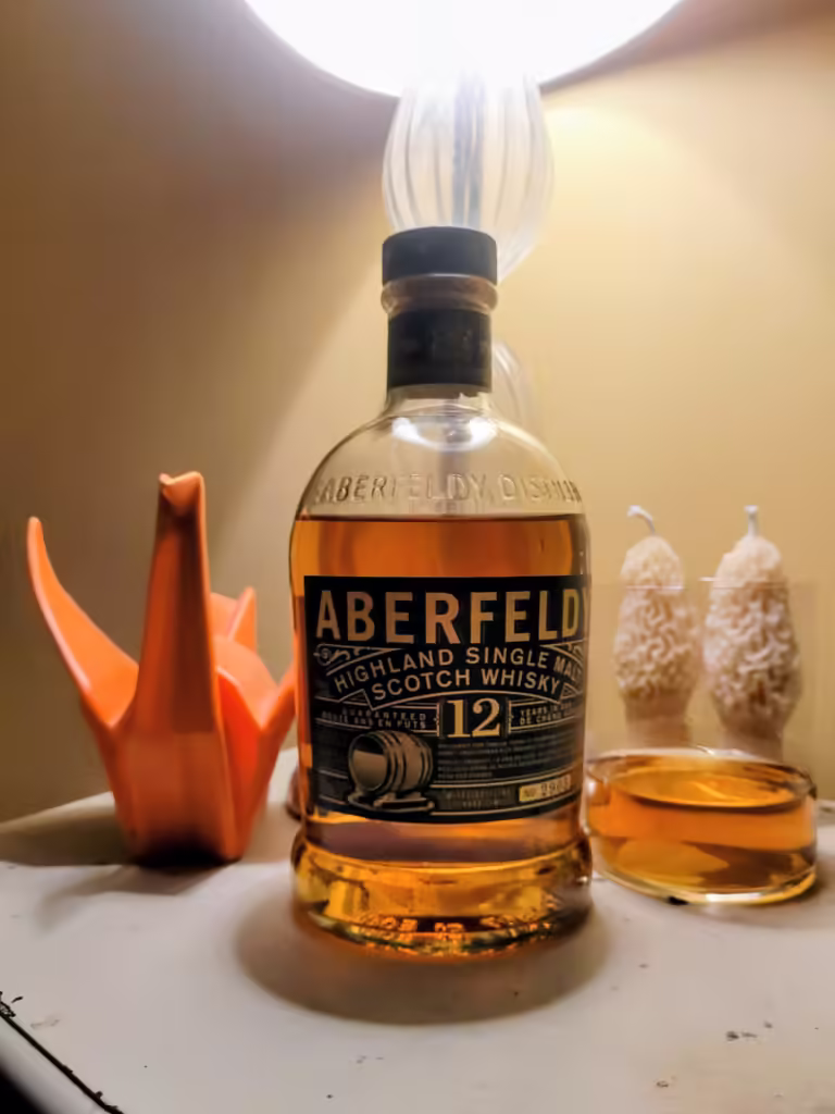 A bottle of Aberfeldy 12 and an accompanying glass.